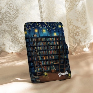 May include: A phone case featuring a detailed illustration of a library at night. The design includes bookshelves, ladders, and soft lighting from lanterns. The name "Giselle" is written on the case. The case has a dark blue background.