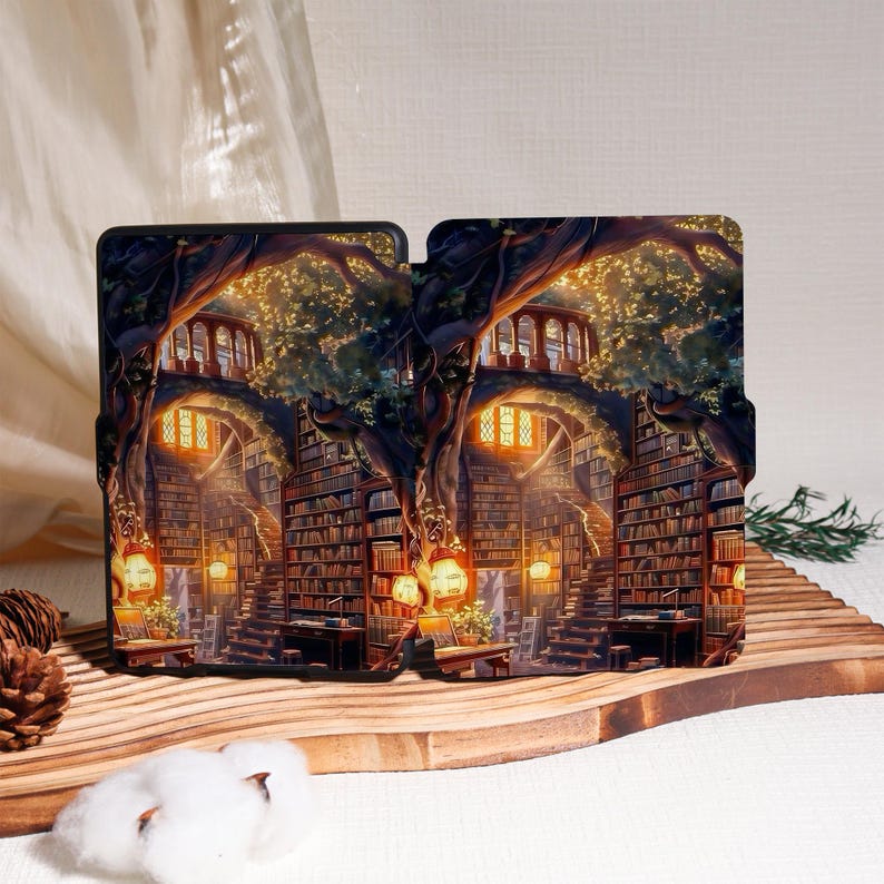 May include: A case featuring a detailed illustration of a fantasy library within a tree. The artwork depicts a winding staircase, bookshelves, and warm lighting, creating a cozy and inviting atmosphere. The case is designed to protect a tablet or e-reader.