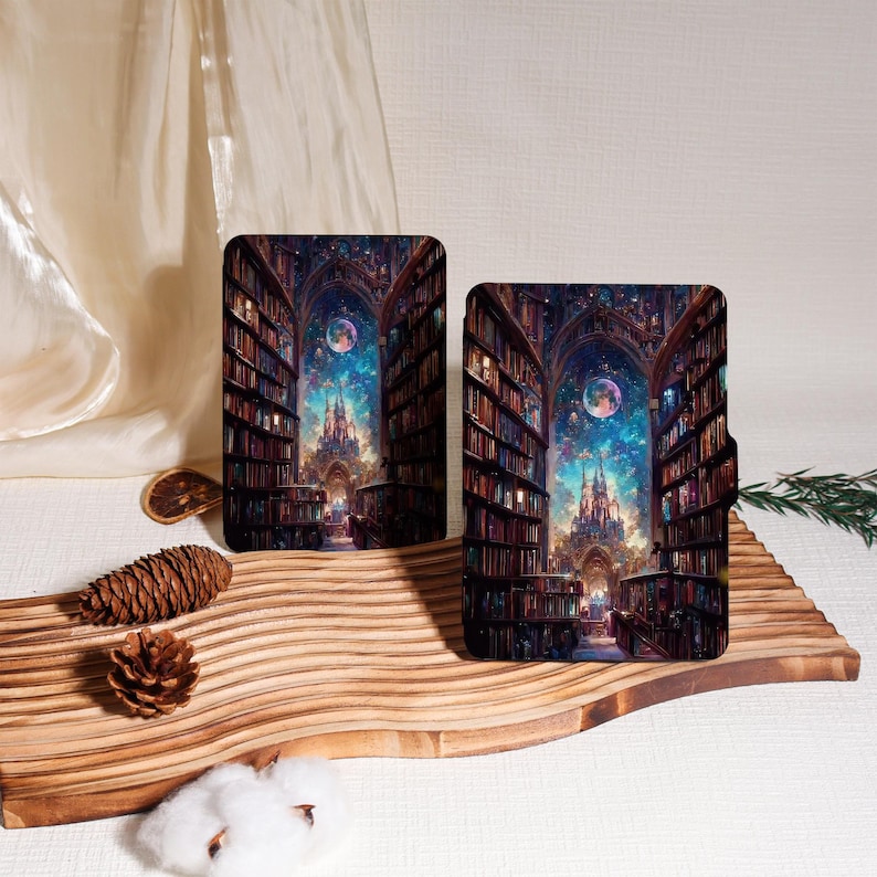 May include: Two rectangular cases with a fantasy library scene. The artwork features rows of bookshelves, a castle, and a celestial sky. The cases are displayed on a wooden surface with decorative elements.