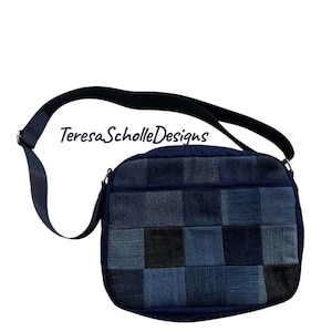 May include: A blue denim patchwork shoulder bag with a long adjustable strap. The bag features a variety of denim squares in different shades of blue and black. The text "TeresaScholleDesigns" is printed on the bag.