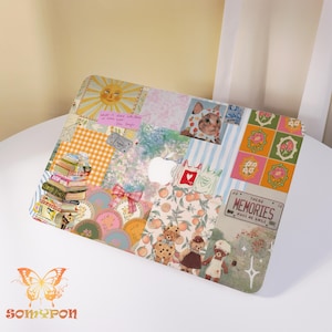 May include: A decorative laptop case featuring a patchwork design with various patterns and illustrations. The design includes a sun, books, a cat in a hat, and the text "THESE MEMORIES MAKE ME SMILE". The case has a white Apple logo cutout.
