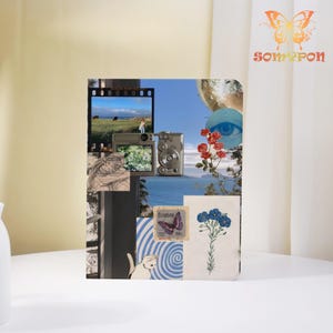 May include: A collage-style notebook with various images, including a camera, a film strip, a butterfly stamp, and a blue floral illustration. The notebook has a white background and a logo with a butterfly and the text "SOMYPON".