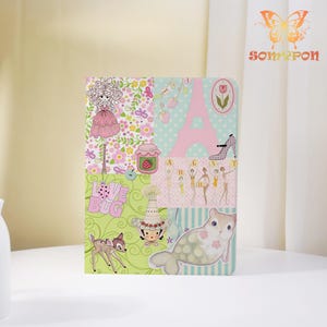 Pode incluir: Um caderno retangular com uma capa de colagem de vários painéis apresentando ilustrações de uma menina, a Torre Eiffel, um pote de geleia de morango, um cervo, uma foca e o texto "LOVE BUG" e "AGST". O design inclui padrões florais, de bolinhas e espirais.