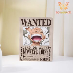 May include: A rectangular poster featuring a cartoon character with the text "WANTED" at the top. The poster includes the text "DEAD OR ALIVE? MONKEY D. LUFFY" and a monetary value. The character is smiling with their hand over their eyes.