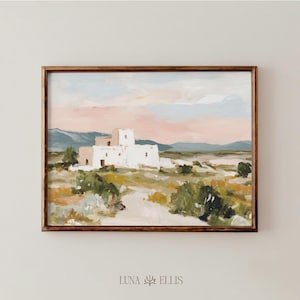May include: An abstract landscape painting in a wooden frame. The artwork depicts a white adobe structure in a desert setting, with a pink and blue sky. The painting is signed "LUNA ELLIS" at the bottom.