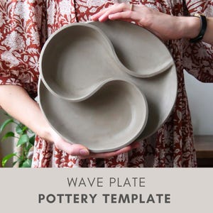 May include: A gray, wave-shaped pottery template with three distinct sections. The plate is held by a person wearing a floral patterned dress. The text "WAVE PLATE POTTERY TEMPLATE" is displayed at the bottom of the image.