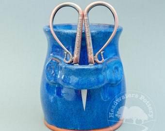 Blue craft caddy with scissors, notion jar with shears