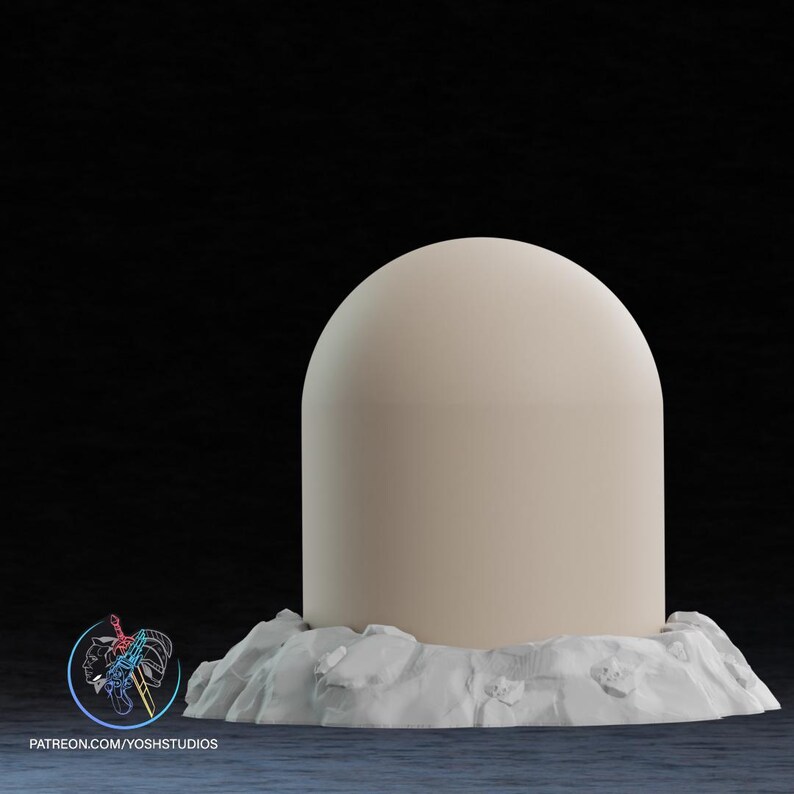 May include: A beige, dome-shaped object atop a textured, white base. The object has a smooth surface and rounded top. The base appears to be made of stone or a similar material. The background is dark.