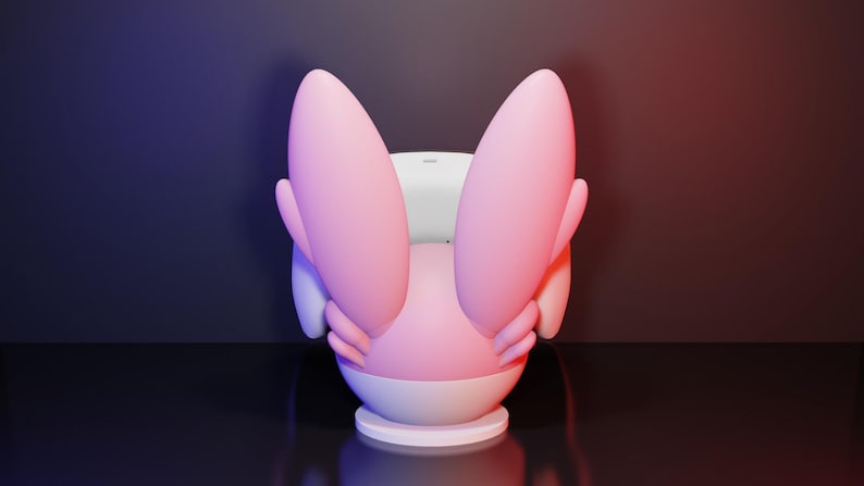 May include: A 3D-rendered chair in a whimsical design, featuring a pink and white color scheme. The chair has large, rounded pink elements that resemble ears or wings, and a white seat. The background has a gradient of purple and red.
