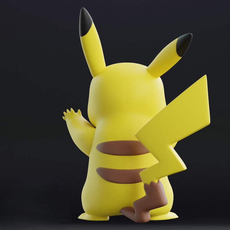 May include: A yellow Pikachu figurine, viewed from the back, with a lightning bolt tail and brown stripes. The ears have black tips, and the figure is set against a dark background. The figurine is a collectible item.