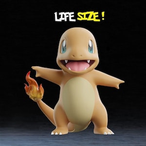 May include: A 3D-rendered figure of Charmander, a popular character from the Pok&eacute;mon franchise. The figure is orange with a cream-colored belly and a flame on its tail. The text "LIFE SIZE!" is displayed above the figure.