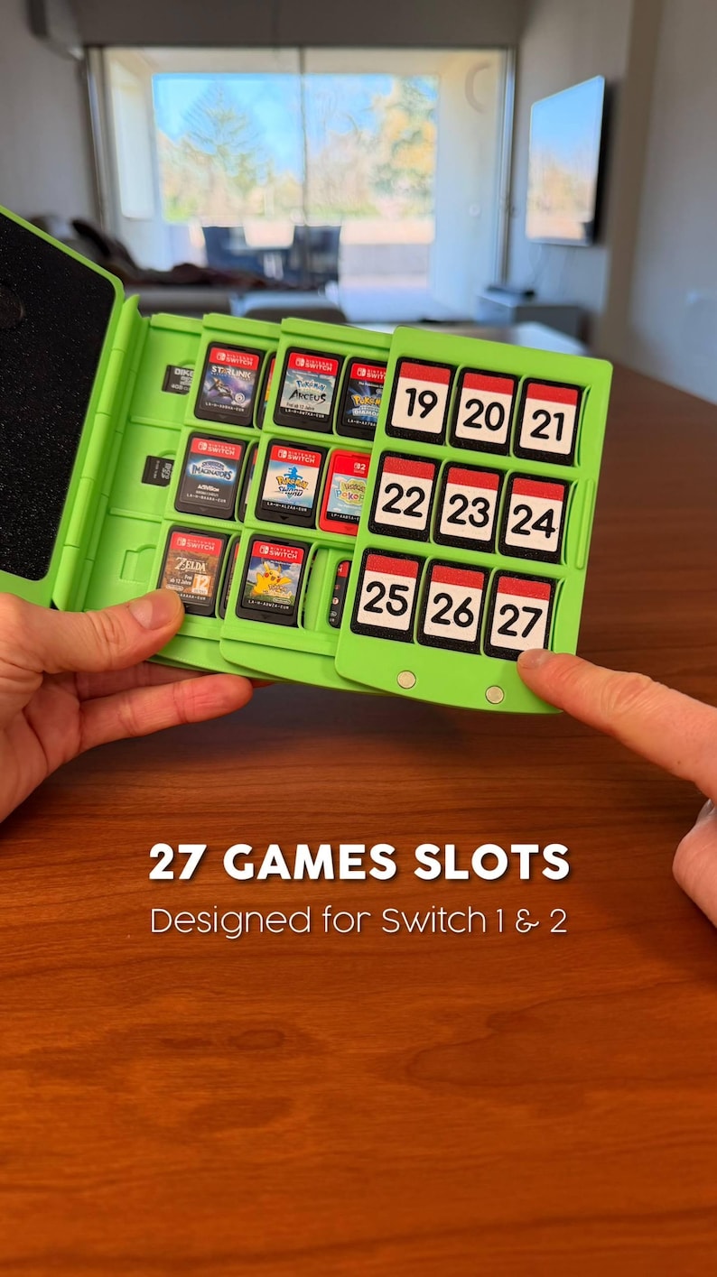 May include: A lime green game cartridge case with 27 slots, designed for Switch 1 & 2 games. The case is open, revealing game cartridges and numbered slots. The text "27 GAMES SLOTS" and "Designed for Switch 1 & 2" is displayed.