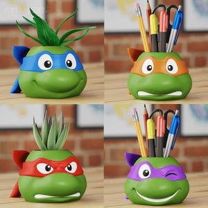 May include: Four Teenage Mutant Ninja Turtles themed desk organizers. Each organizer is a green turtle head with a different colored mask. The organizers are filled with pens, pencils, and scissors.