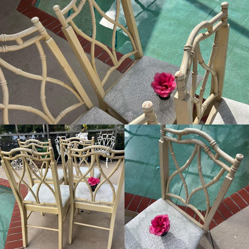 May include: Set of cream-colored bamboo-style chairs with patterned gray seats. The chairs have a decorative back design and are arranged outdoors. A vibrant pink flower rests on one of the seats, adding a pop of color to the scene.