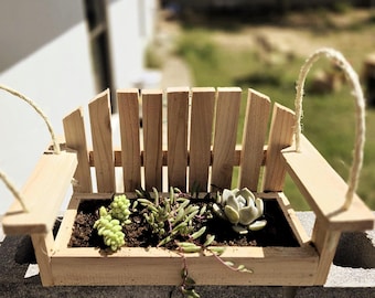A Cute Mini Hanging Porch Swing Cedar Planter combines rustic charm with a playful twist—it&#39;s a tiny porch swing made of cedar wood.