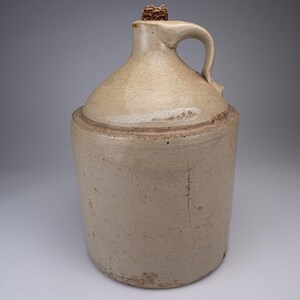 Antique Stoneware Whiskey Jug with Corncob Cork Stopper Finger Loop Handle