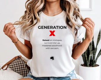 May include: White t-shirt with the text "GENERATION X" in black, a red "X", and the phrases "Raised on mixtapes, survived dial-up, mastered adulthood with sarcasm." A black fist graphic is below the text.