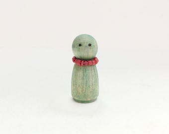 Tiny wood jade green effigy with coral necklace