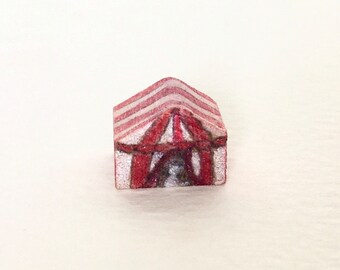 Tiniest wood circus tent with white cat