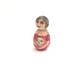 Tiny wood woman with skull