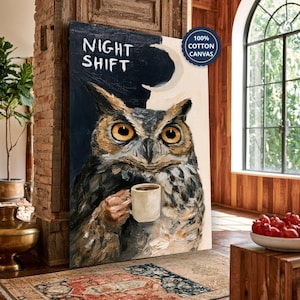 May include: A rectangular canvas print featuring an oil painting of an owl with large yellow eyes holding a white coffee mug. The background is split between dark blue and cream, with the text NIGHT SHIFT and a crescent moon visible.