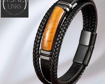 Leren armband met tijgeroogsteen, meerlaagse zwarte banden, ringen van gepolijst metaal, sluiting, moderne armband.