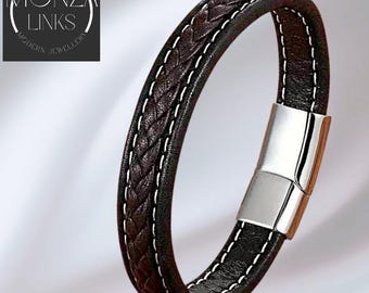 Pulsera de cuero trenzado estilo marrón y negro con costuras en contraste y cierre magnético seguro.