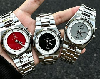 Reloj con caracteres chinos de Mahjong dinámicos, reloj de cuarzo retro unisex, reloj de pulsera animado único con amuleto de la suerte, regalo para hombres y mujeres.