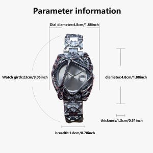 May include: A silver-toned watch with an intricate, textured design around the face and band. The watch face is a light silver color. The dial diameter is 1.88 inches, the watch girth is 9.05 inches, the breadth is 0.70 inches, and the thickness is 0.51 inches. The text "Parameter information" is at the top.