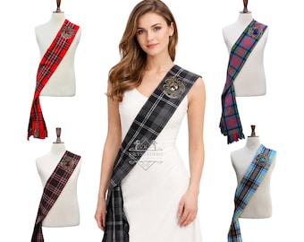 May include: A collection of five tartan sashes in various plaid patterns, including red, grey, blue, and black, each secured with a circular metal brooch. The text "Available in 100+ Tartans" is displayed at the top of the image.