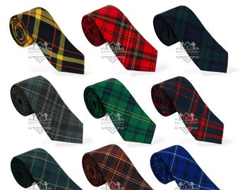 May include: A collection of nine tartan ties in various colors, including red, green, blue, and brown. Each tie features a distinct plaid pattern. The text "Available in 50+ Tartans Tie" is displayed at the top.