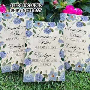 May include: Three blue and white floral patterned seed packets with the text "Something Blue Before I Do" and "Evelyn's Bridal Shower" with the date "11.18.2025".