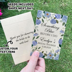 May include: A light blue and white floral design with the text "Something Blue Before I Do Evelyn's Bridal Shower 11.18.2025". The design is on a kraft paper card with a white envelope. The envelope has the text "Thank you for showering the bride-to-be with love! Custom Your Text Here".