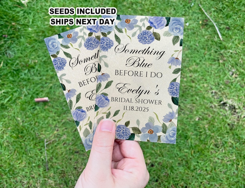 May include: A light blue and white floral design with the text "Something Blue Before I Do Evelyn's Bridal Shower 11.18.2025".