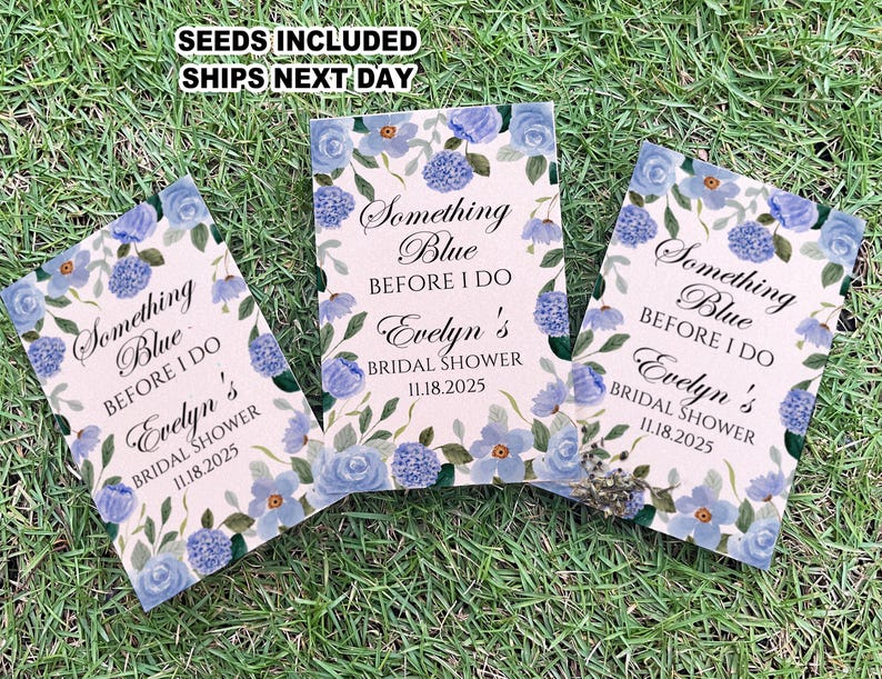 May include: Three blue and white floral patterned cards with the text "Something Blue Before I Do Evelyn's Bridal Shower 11.18.2025" printed on each card.