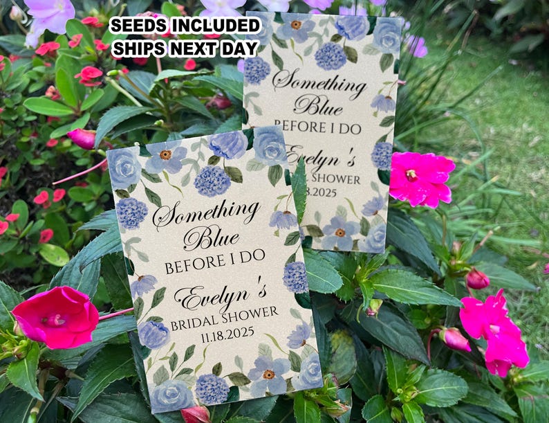 May include: Two blue and white floral patterned cards with the text "Something Blue Before I Do" and the bride's name and shower date. The cards are for a bridal shower.