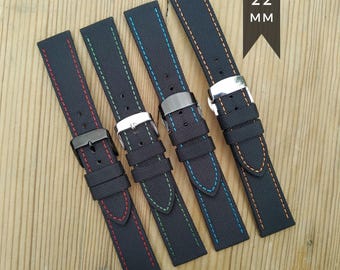 May include: Four black nylon watch straps with colored stitching in red, green, blue, and orange. Each strap has a metal buckle. The image includes the text "20 22 MM" and "2 PIECE NYLON STRAP".