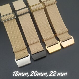 Könnte beinhalten: Nahaufnahme von vier beigefarbenen Uhrenarmbändern mit unterschiedlich farbigen Metallschnallen: Silber, Schwarz, Gold und Roségold. Unten steht der Text "18mm, 20mm, 22mm". Die Armbänder sind 18 mm, 20 mm und 22 mm breit.