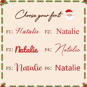 May include: A cream-colored font selection chart featuring a holly leaf border, a Santa Claus icon, and the text Choose your font. It displays the name Natalie in six distinct red font styles labeled F1 through F6 in dark brown text.