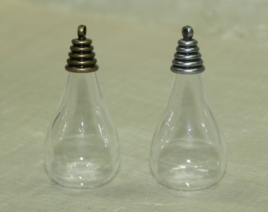 Set of Five Teardrop Blown Glass Globes With Brass and Silver Pendant