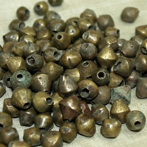 Bag of 8 Antique Brass/Bronze Bicones from Northern Nigeria, Made in the 1900s. MET1000