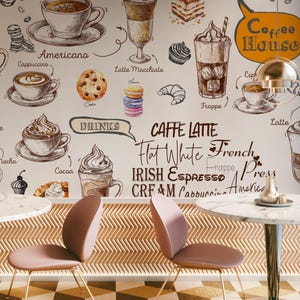 May include: A coffee house interior with a wall mural featuring various coffee drinks like lattes and cappuccinos. The mural includes the text "Coffee House" and "Caffe Latte". Two pink chairs and marble tables are in the foreground.