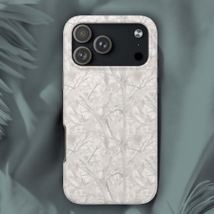 May include: A white phone case with a tree branch pattern. The case has a matte finish and a black camera module with three lenses. The design features a repeating pattern of bare tree branches in shades of white and gray.