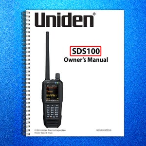 May include: A black Uniden SDS100 scanner with a long antenna, next to a white spiral-bound manual. The manual has the Uniden logo and text that reads "SDS100 Owner's Manual". The background is a textured blue.