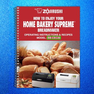 May include: A spiral-bound cookbook titled "How to Enjoy Your Home Bakery Supreme Breadmaker" by Zojirushi. The cover is red with white text and features images of various breads and two bread machines. Model BB-CEC20.