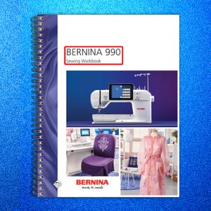 May include: A spiral-bound sewing workbook with the text "BERNINA 990 Sewing Workbook" on the cover. The cover features a white sewing machine with a digital display, a purple chair cover, and a pink dress.