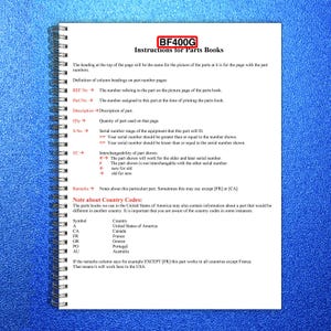May include: A spiral-bound notebook with a blue cover displaying a page titled "Instructions for Parts Books." The page includes definitions of terms like "REF No," "Part No," and "Q'ty," along with country codes.