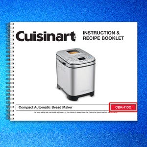 May include: A Cuisinart compact automatic bread maker with a stainless steel finish, displayed on a white instruction and recipe booklet. The booklet also features the model number CBK-110C.