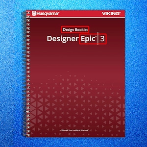 May include: A red spiral-bound design booklet titled "Designer Epic 3" with the Husqvarna and Viking logos at the top. The booklet has a geometric pattern and the text "Design Booklet" is also visible.