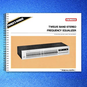 May include: A white spiral-bound owner's manual for a Realistic Twelve Band Stereo Frequency Equalizer, Cat. No. 31-2010. The cover features a black and silver graphic of the equalizer unit centered on a light orange rectangular background.